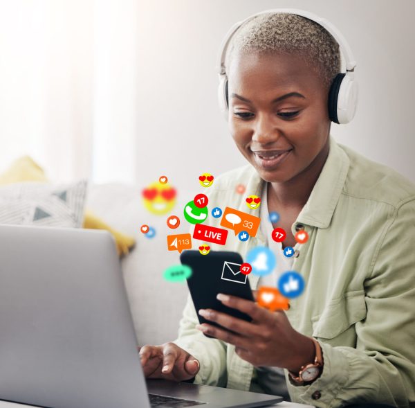 Laptop, social media icon or woman with phone for communication, message or online chat. Headphones, notification emojis or African person streaming music on mobile app on website or network at home.