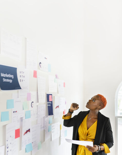 Cool black businesswoman planning a marketing strategy